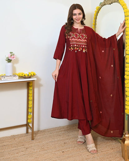 Maroon embroidered Anarkali kurta set with matching dupatta, featuring intricate embroidery and traditional Indian design.