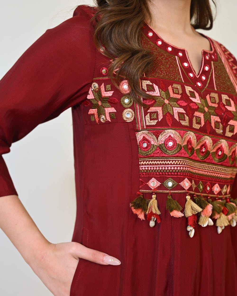 Maroon embroidered Anarkali kurta set with matching dupatta, featuring intricate embroidery and traditional design.