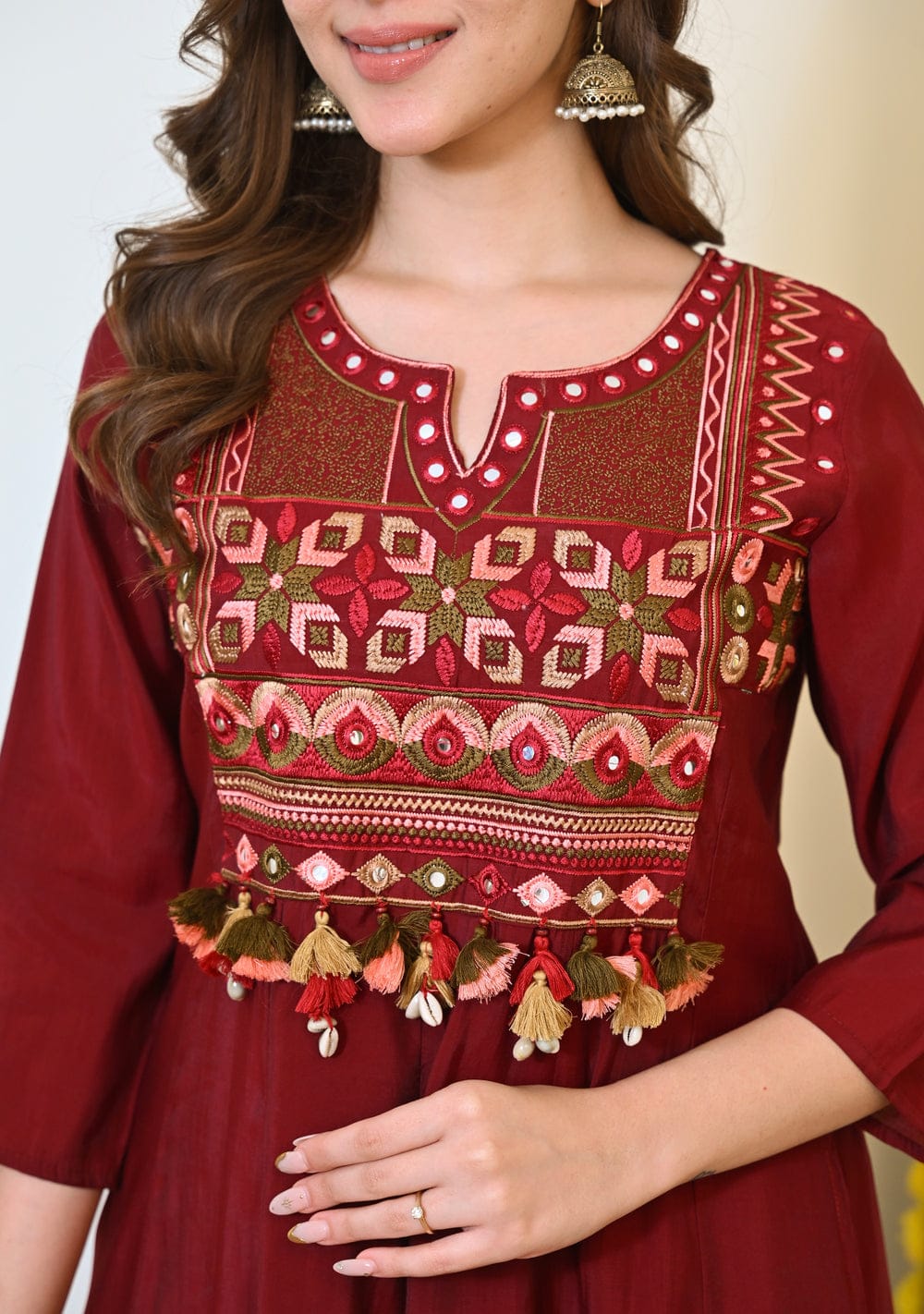 Maroon embroidered Anarkali kurta set with matching dupatta, featuring intricate embroidery and traditional design.