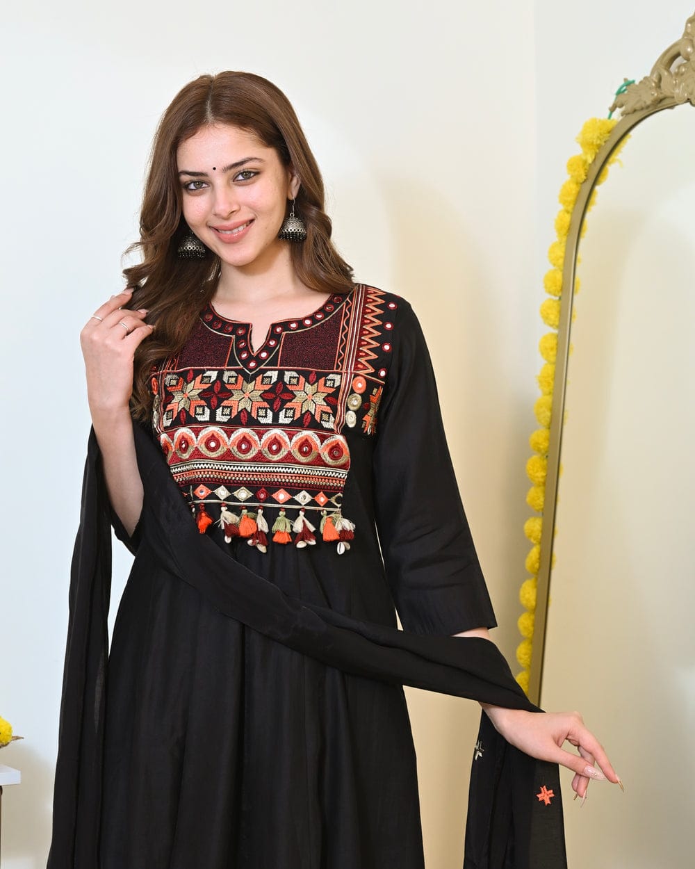 Maroon embroidered Anarkali kurta set with matching dupatta, traditional Indian attire, detailed embroidery, and elegant design.